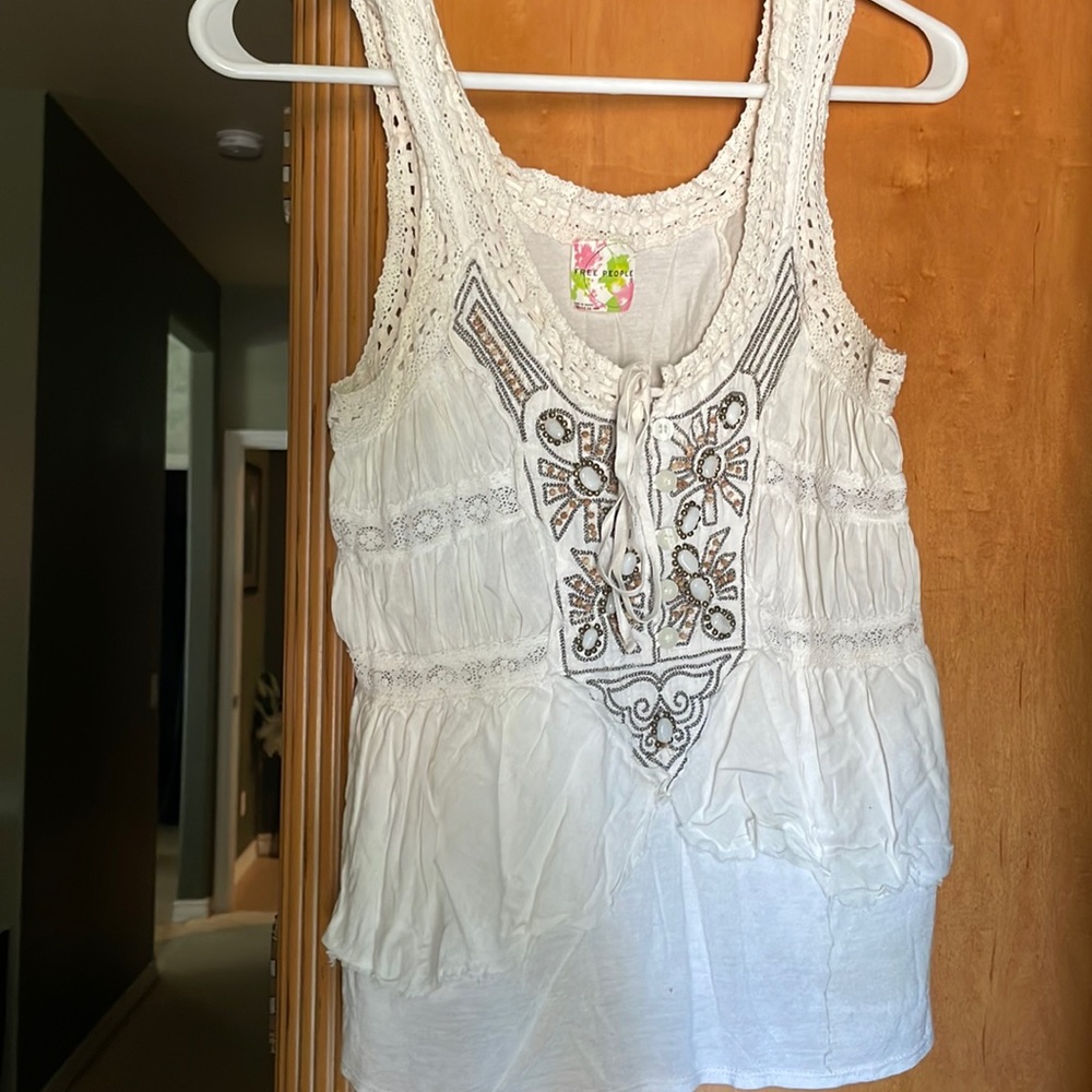 Light pink vintage free people tank top with beaded detailing and back tie.